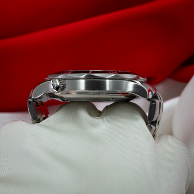 Omega Seamaster 212.30.41.20.01.002, side profile of case, crown and bracelet on a white cloth.