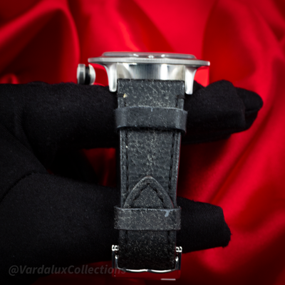 Tudor Black Bay 79730-0005 watch, case profile with crown and black leather strap.