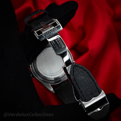 Tudor Black Bay 79730-0005 watch with view of the caseback and the watch's deployant clasp on a black leather strap.