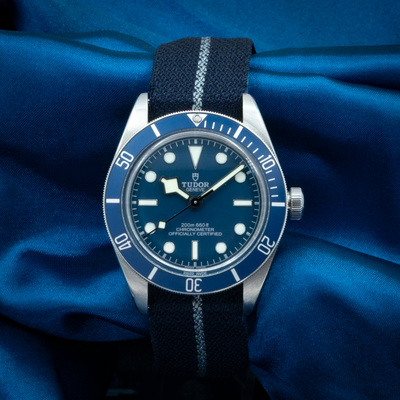 Tudor Black Bay Fifty-eight Blue M79030B-0003 watch with a blue dial and black textile strap.