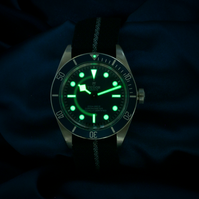 Tudor Black Bay Fifty-eight Blue M79030B-0003 dial, glowing green in the dark.