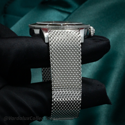 Breitling SuperOcean Heritage B31 AB31100361L1A1, side view of case, crown, and Milanese mesh bracelet.