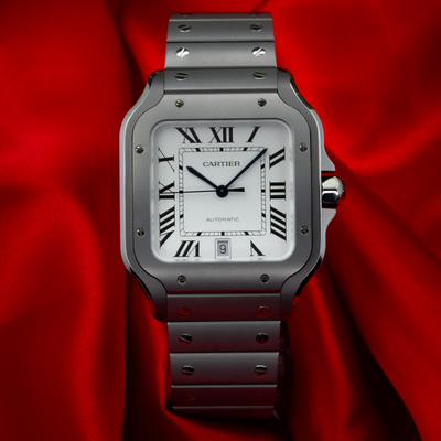 Cartier Santos WSSA0089 watch with white dial, Roman numerals, and date window.