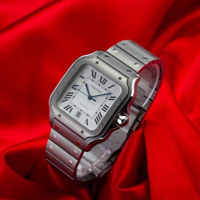 Cartier Santos WSSA0089 dial and case on a red background.
