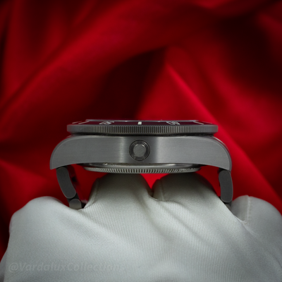 Tudor Pelagos 25600TN case, side view showcasing the helium escape valve and fluted crown, bezel edge, and bracelet link.