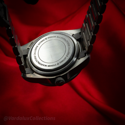 Tudor Pelagos 25600TN caseback with caliber MT5612 inscription, crown, and bracelet visible.