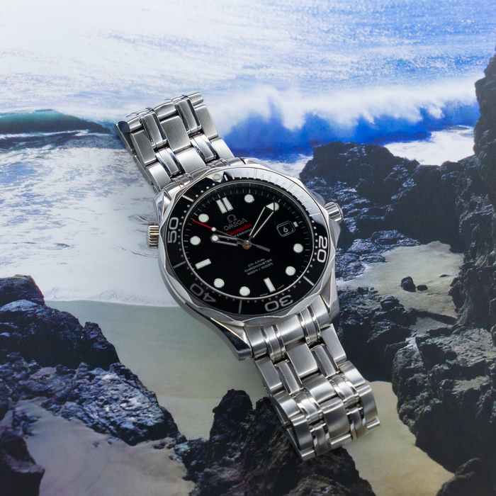 Omega Seamaster Diver 212.30.41.20.01.003, full watch with black dial and metal bracelet, top view.