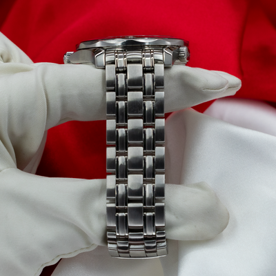 Omega Seamaster Diver 212.30.41.20.01.003, side view of case and steel bracelet on white glove.