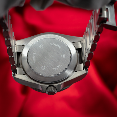 Tudor Pelagos 25500TN caseback with branding, serial number J645702, and crown with logo.