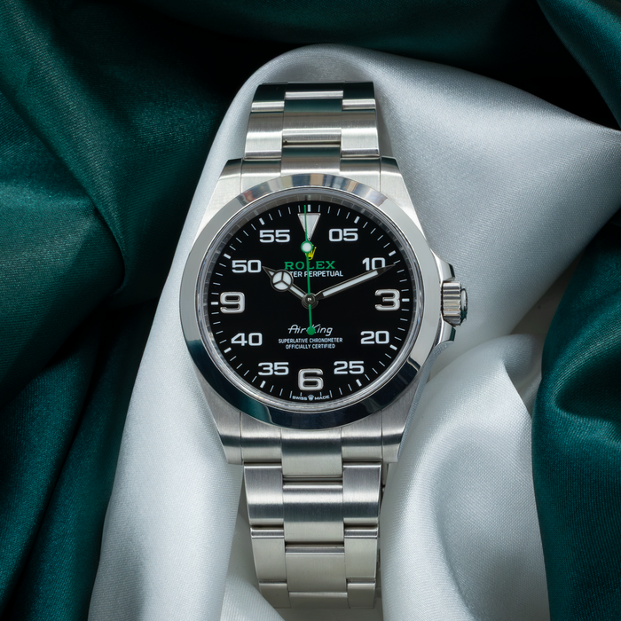 Rolex Air King Automatic Black Dial 126900 showing the full black dial with Arabic numerals and steel bracelet.