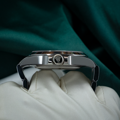 Rolex Air King Automatic Black Dial 126900: close-up side view of watch case and crown with crown guards.