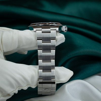 Rolex Air King Automatic Black Dial 126900, side view of the stainless steel case, crown, and bracelet.
