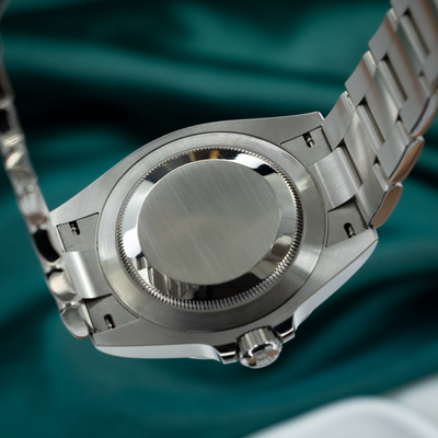 Rolex Air King Automatic Black Dial 126900 caseback, polished screw-down with a brushed center, fluted edge.