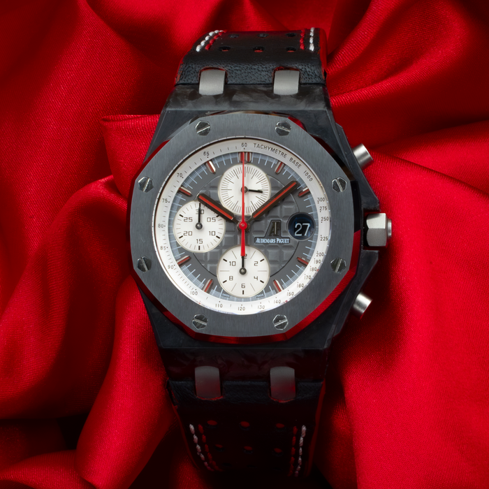 Audemars Piguet Jarno Trulli 26202AU.OO.D002CA.01, close-up of the textured gray dial with white subdials and red accents.