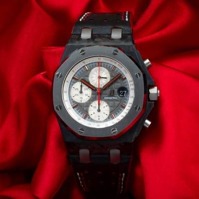 Audemars Piguet Jarno Trulli 26202AU.OO.D002CA.01, close-up of the textured gray dial with white subdials and red accents.