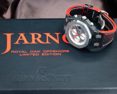 Audemars Piguet Jarno Trulli 26202AU.OO.D002CA.01, angled view of the dial, case, and strap on its box.