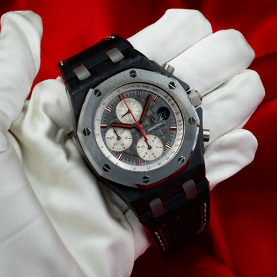 Audemars Piguet Jarno Trulli 26202AU.OO.D002CA.01, close-up of the grey dial with red accents and white sub-dials.