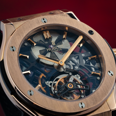 Hublot Gold Skeleton 505.OX.0180.LR dial, showing gold hands and markers over the intricate skeleton movement.