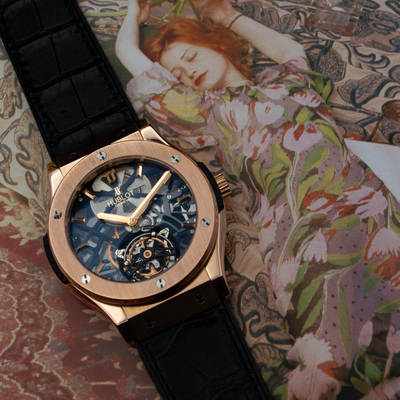 Hublot Gold Skeleton 505.OX.0180.LR, partial dial view with the crown and part of the strap.