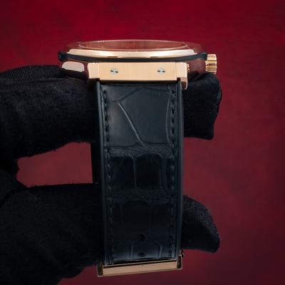 Hublot Gold Skeleton 505.OX.0180.LR, right side view showing the case, crown, and black alligator strap.